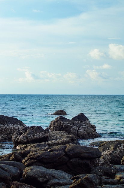 Dreamy seascape with big rocks, blue sky and clouds. Thailand, Kata beach. Space for text.