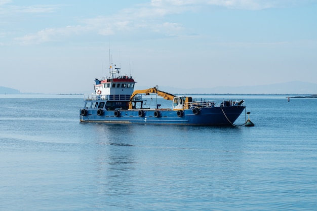 Dredge ship in the harbor of Carril, Pontevedra, Spain