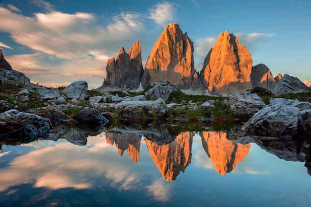 Drei Zinnen or Tre Cime di Lavaredo with reflection in lake at sundown Dolomites South Tirol Italian Alps Europe