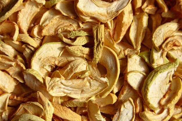 Dried apple chips fruit slices food background top view