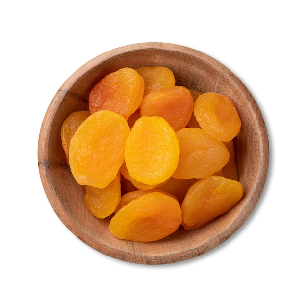 Dried apricots in a bowl isolated over white background