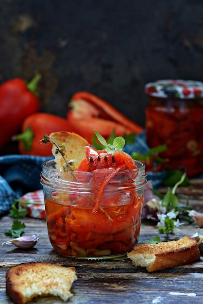 Dried baked Bulgarian red pepper paprika with herbs rosemary thyme marjoram garlic with olive