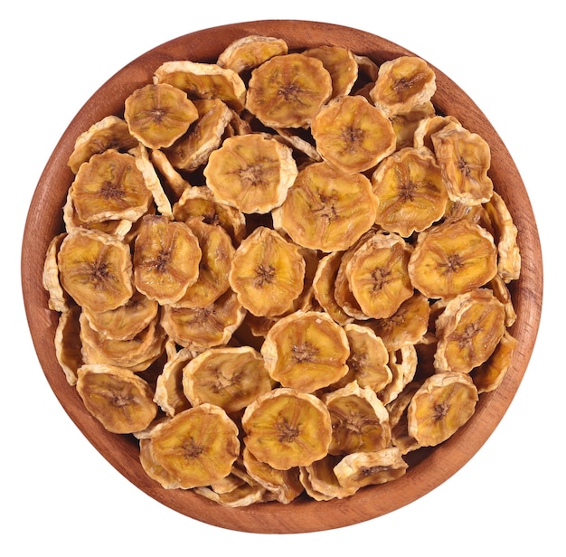 Dried bananas in a wooden bowl on a white background