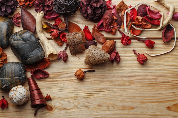 Dried bark and aroma flowers on a wooden table