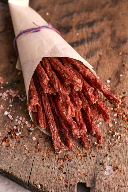 Dried beef and pork meat slices with spices and herbs