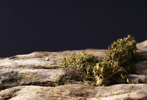 Dried cannabis on a wooden table