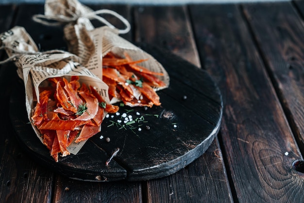 Dried chicken in bags on a wooden board closeup High quality photo