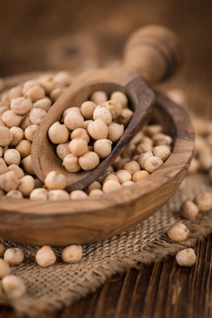 Dried Chickpeas on wooden background selective focus