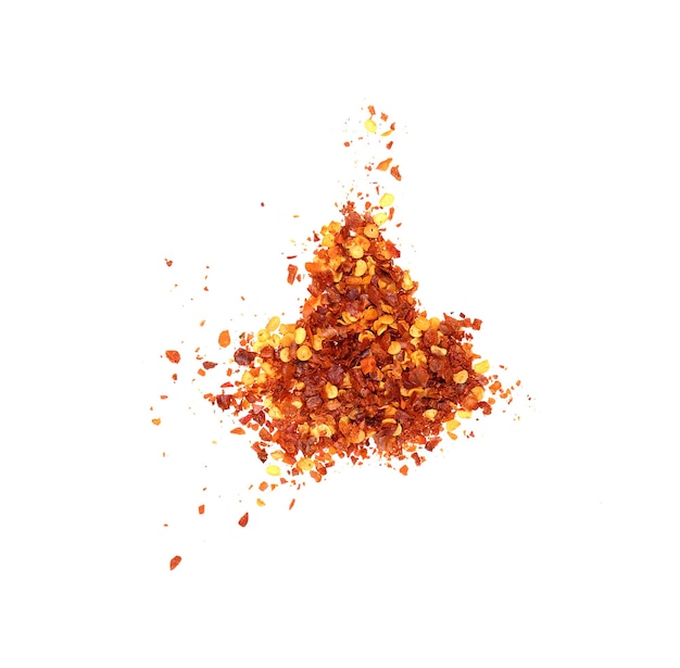 Dried chili flakes and seeds isolated on white, top view