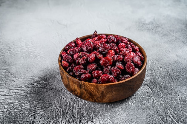 Dried cranberries in a wooden bowl