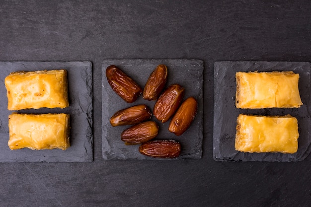 Dried dates fruit with eastern sweets on table