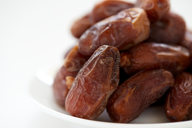 Dried Dates Fruits on dish white background