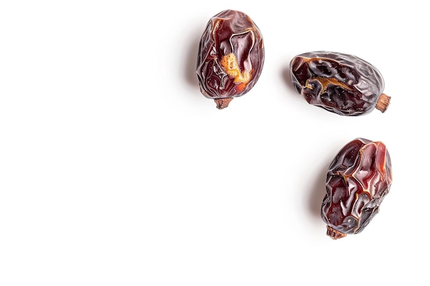 Photo dried dates on a white background the concept of healthy eating