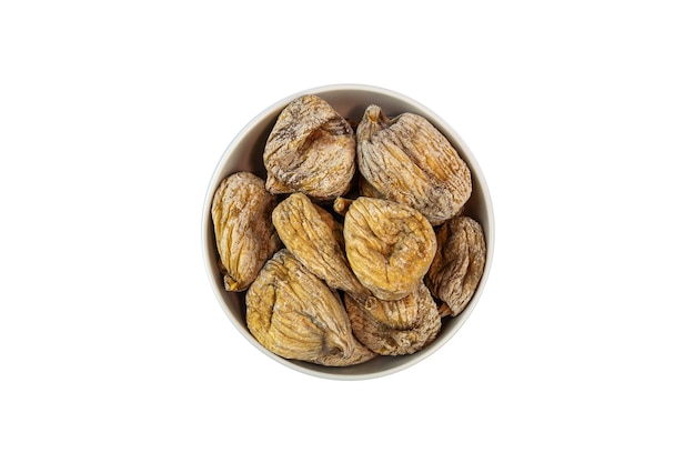 Dried figs in a bowl on a white surface