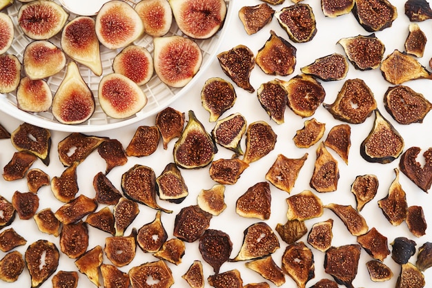 Dried figs lie next to fresh ones on the table