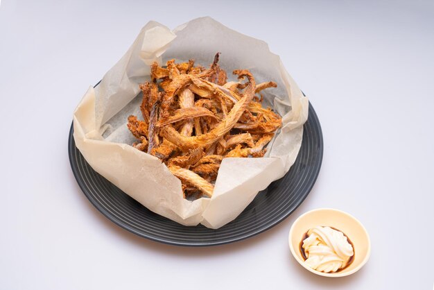 Dried fish in a bowl and mayonnaise sauce