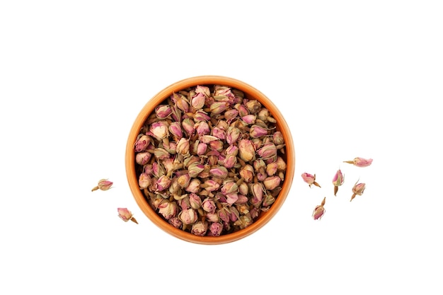 Dried flowers whole rose buds in bowl Pink Rose buds used in herbal medicine perfumery and culinary