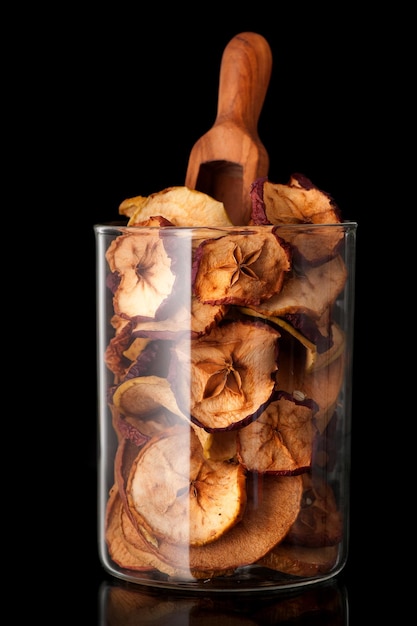 Dried fruits apples on black background