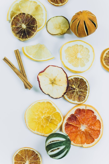 Dried fruits, lemons, oranges, lime, apples on isolated background