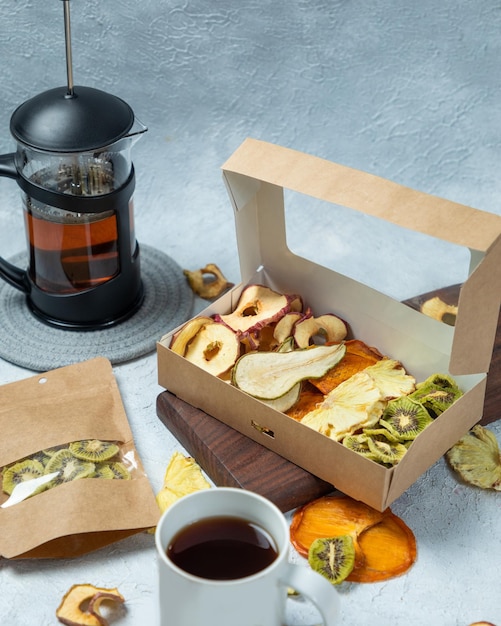 Dried fruits mixed in paper package with tea