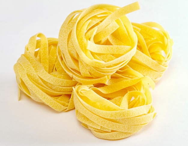 Dried italian pasta on white background