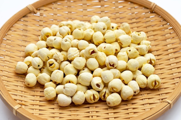 Dried lotus seeds in bamboo plate