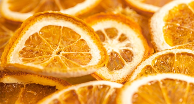 Dried orange slices orange blurred background, selective focus, space for text.