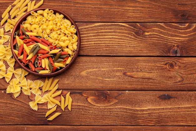 dried pasta on wooden background