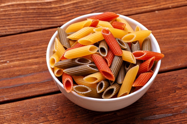 dried pasta on wooden table