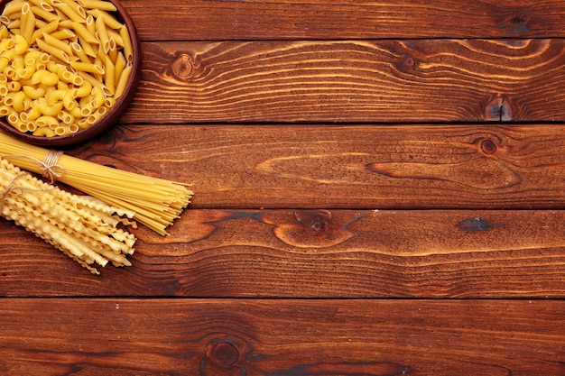 Dried pasta on wooden 