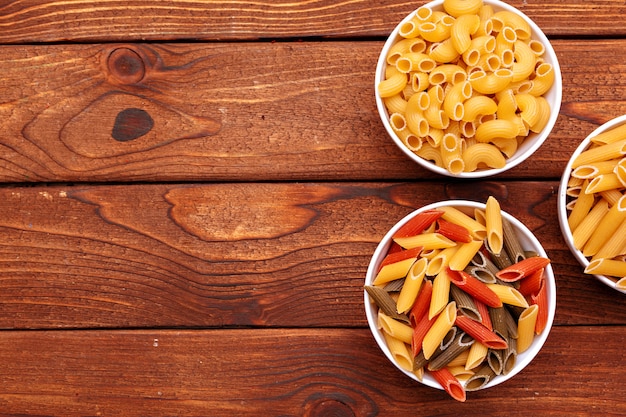 Dried pasta on wooden 