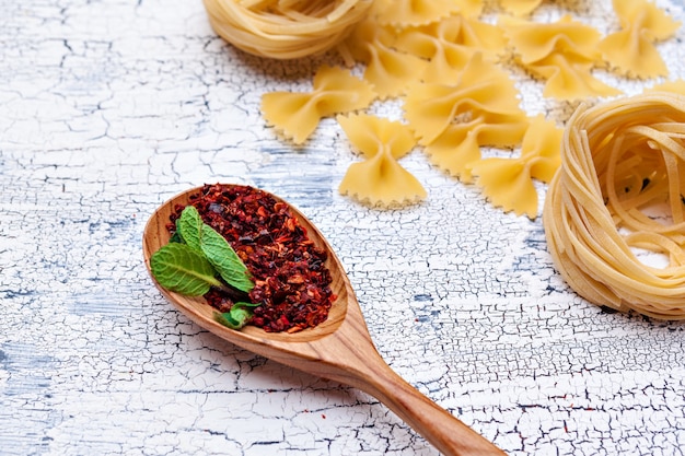 Dried pasta on wooden 