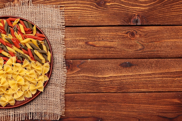 Dried pasta on wooden 