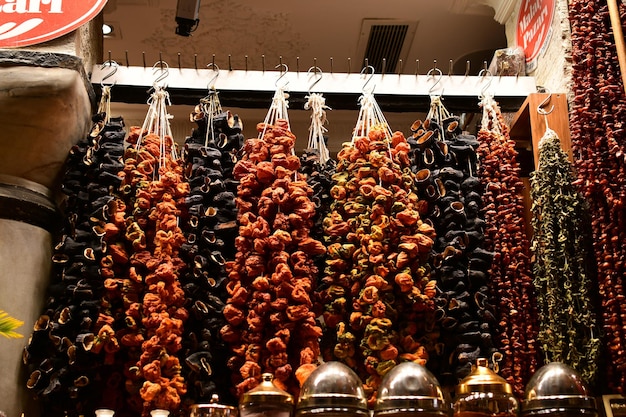 Dried peppers in bunches Sale of dried vegetables at the market counter