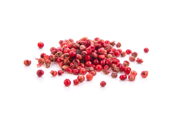 Dried pink peppers isolated on White surface