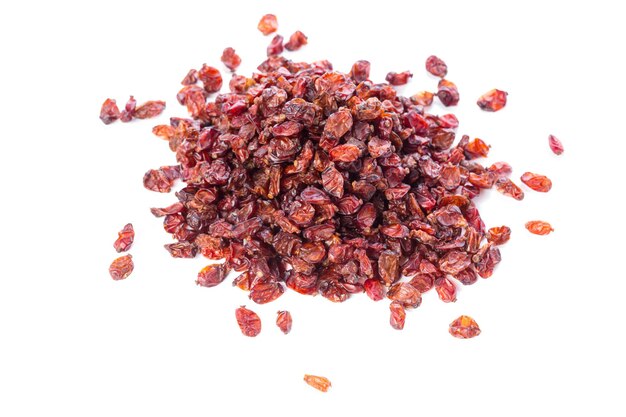 Dried raisins on a white background