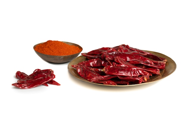 Dried Red Chili Peppers with Chili Powder on White Background