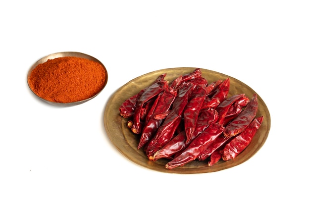 Dried Red Chili Peppers with Chili Powder on White Background