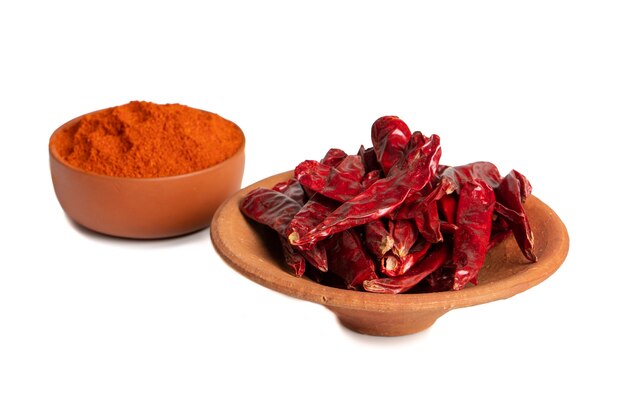 Dried Red Chili Peppers with Chili Powder on White Background