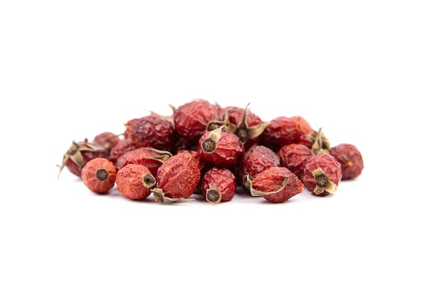 Dried rose hip berries isolated on white background