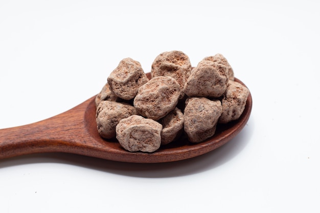 Dried salted Chinese plum isolated on white background