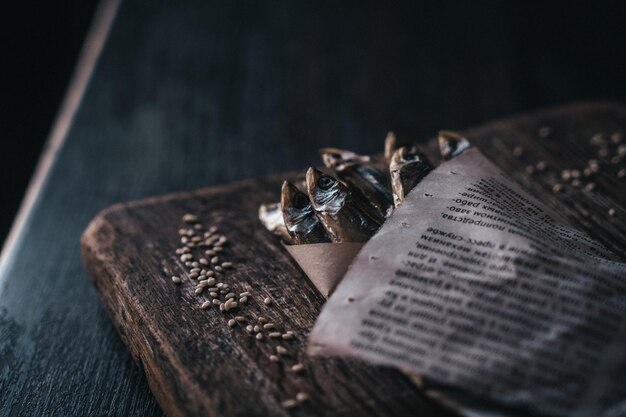 Dried smelt wrapped in newspaper