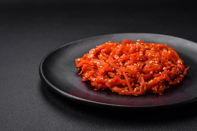 Dried squid chopped into slices and seasoned with sesame seeds and spices