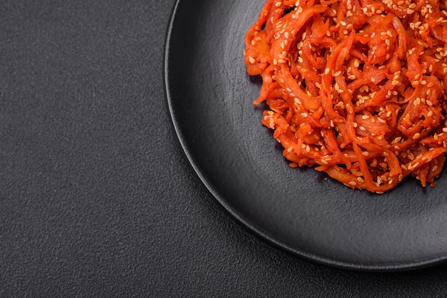 Photo dried squid chopped into slices and seasoned with sesame seeds and spices