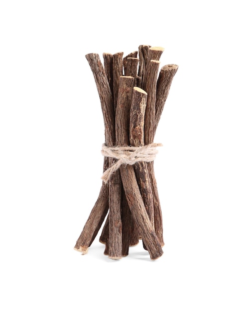 Dried sticks of liquorice root on white background