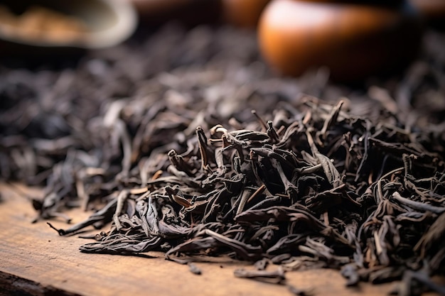 Dried tea leaves macro closeup Dried tea leaves on a wooden table Selective focus Shallow