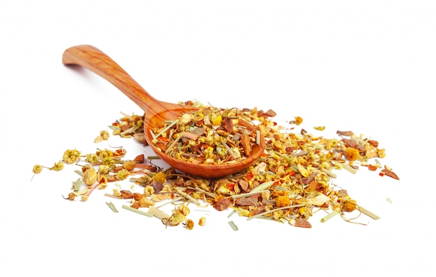 Dried tea on a wooden spoon, isolated