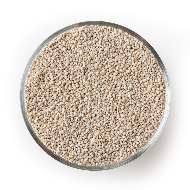 Dried white quinoa seeds in glass bowl isolated on white background with clipping path