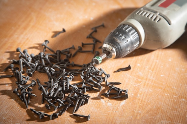 Drill with screws on the table