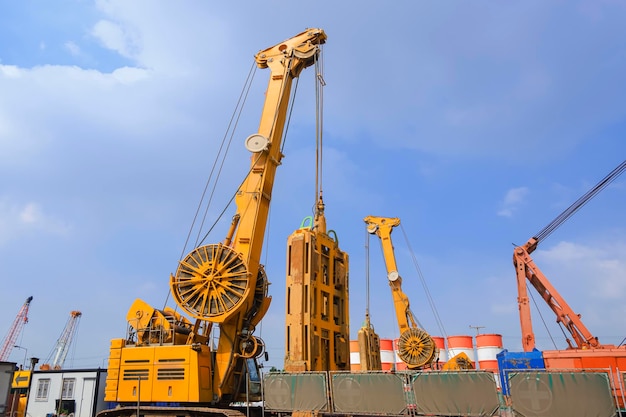 Drilling crawler crane with hydraulic diaphragm wall equipment working in road construction site